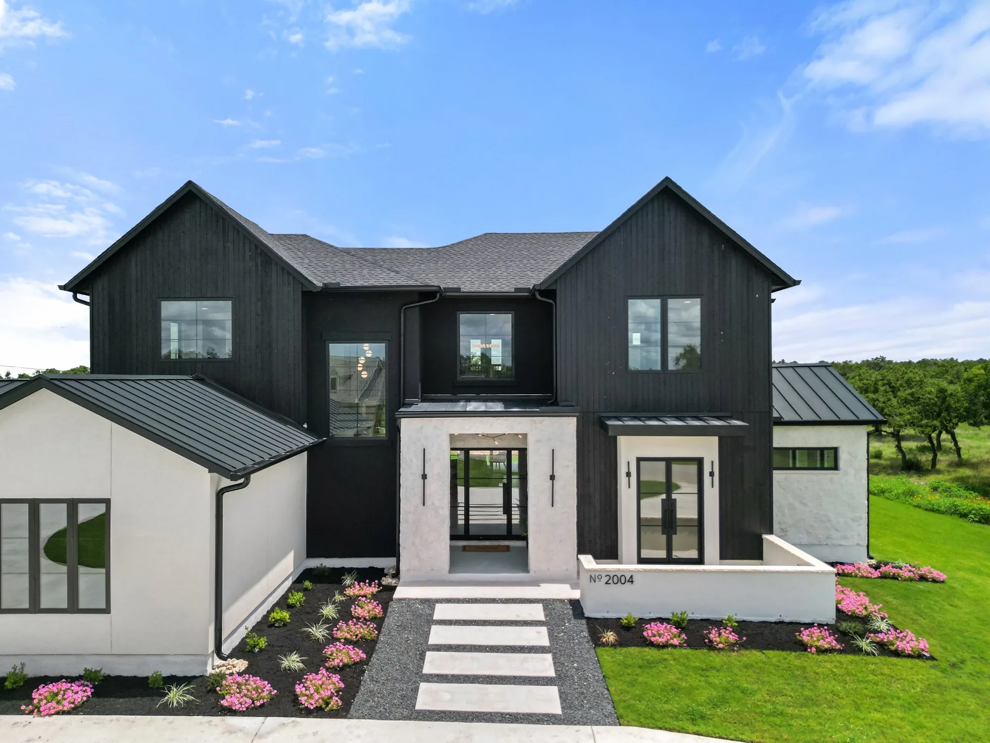 Black board-and-batten two-story