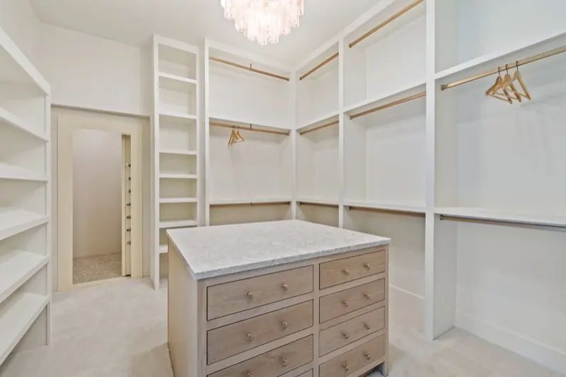 Walk-in closet with marble-topped island