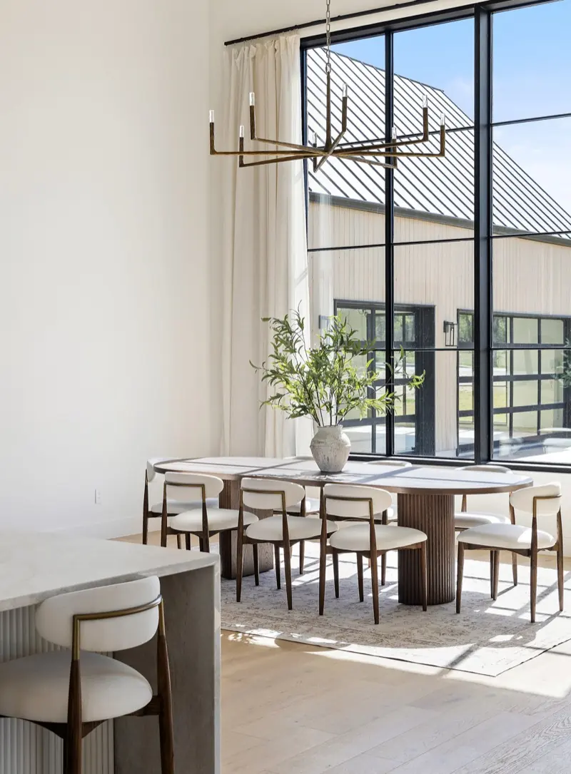 Dining room beneath a sculptural chandelier