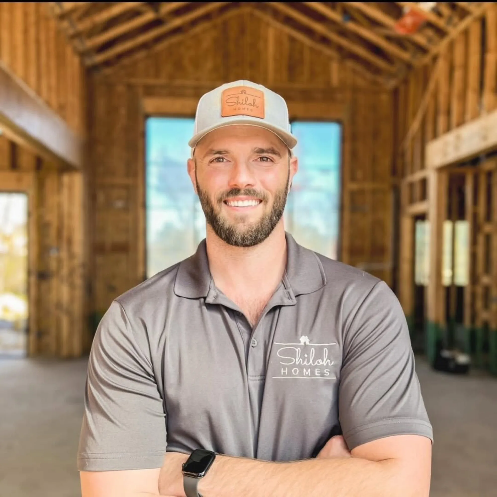 Taylor Shipp in a Shiloh Homes shirt on a framed build